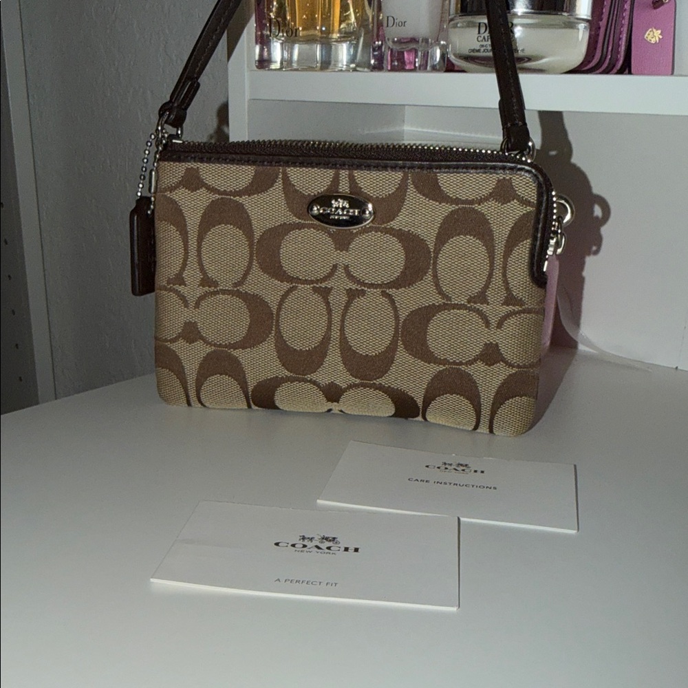 Coach Brown Signature wristlet mini bag